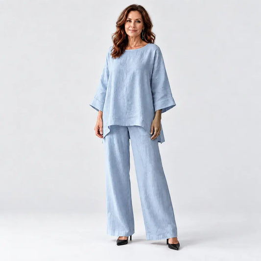 🥰📢📢50% έκπτωση!!!【M-3XL】Γυναικείο σετ με κομψή, μίνιμαλ μπλούζα σε χαλαρή γραμμή (από μείγμα βαμβακιού-λινού και με στρογγυλή λαιμόκοψη) και παντελόνι σε φαρδιά γραμμή.